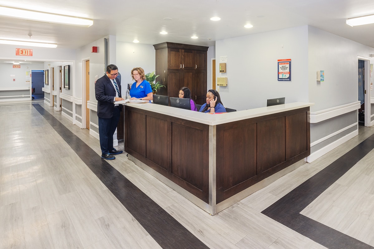 Facility nurse's station with staff working