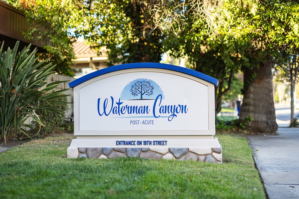 Waterman Canyon sign in front of building